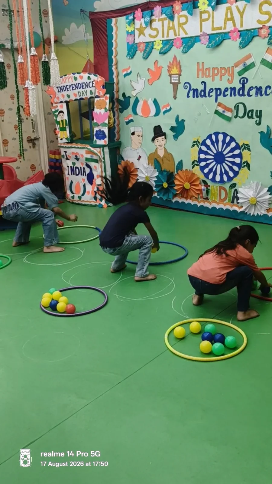 Children taking part in a ball and hoop challenge