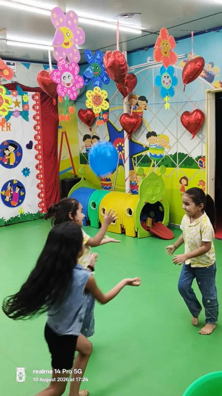 Children taking part in a balloon game