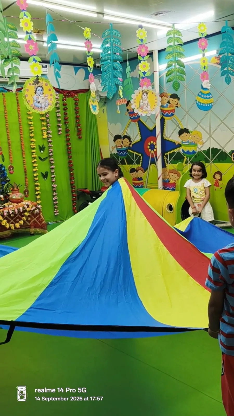 Children working together during parachute play